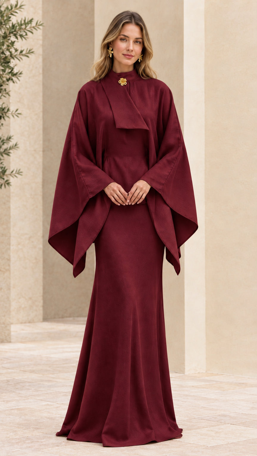 Full front view of deep burgundy cape sleeve maxi evening gown