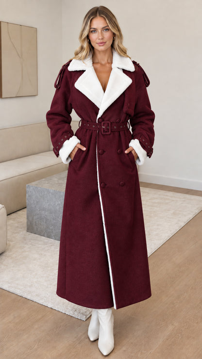 Full-length front view of woman wearing burgundy red faux shearling maxi coat