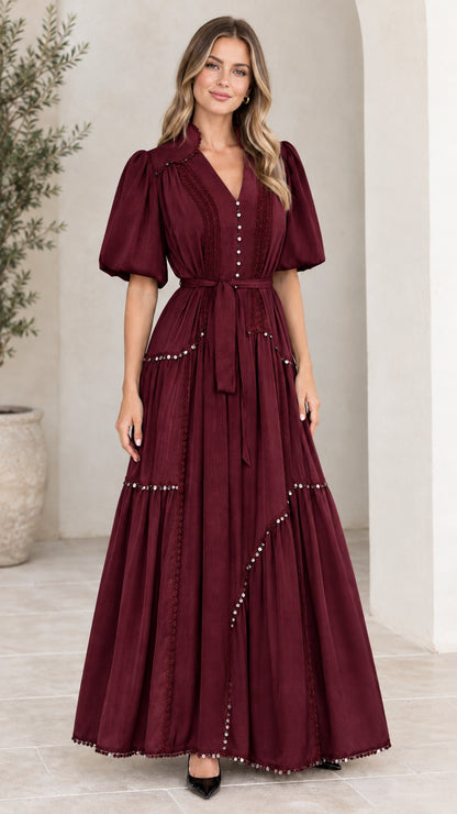 Front view of woman wearing burgundy wine tiered puff sleeve maxi dress
