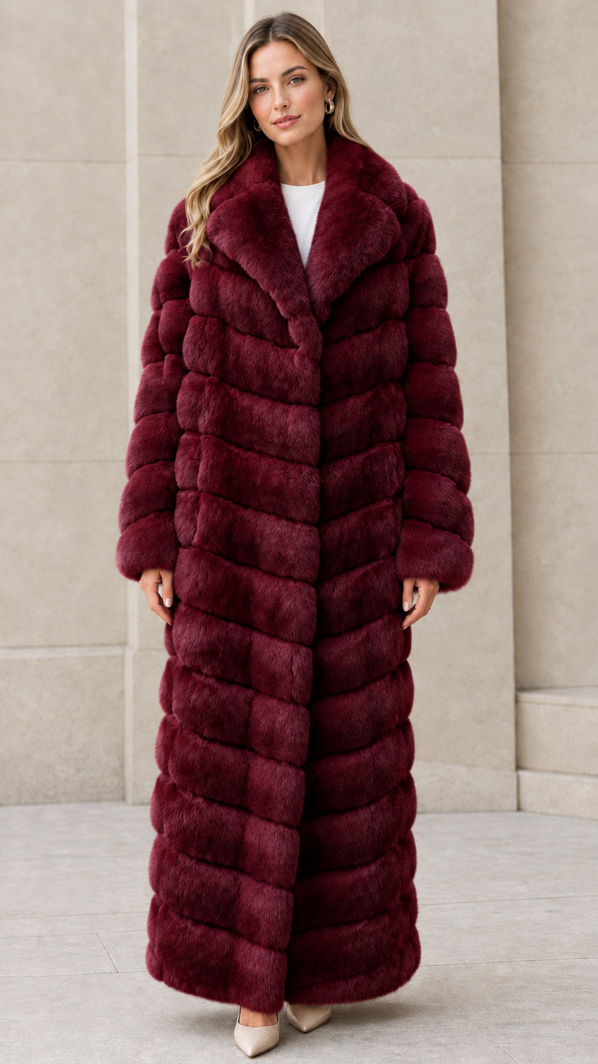 Front full-length view of model wearing Burgundy chevron maxi faux fur coat