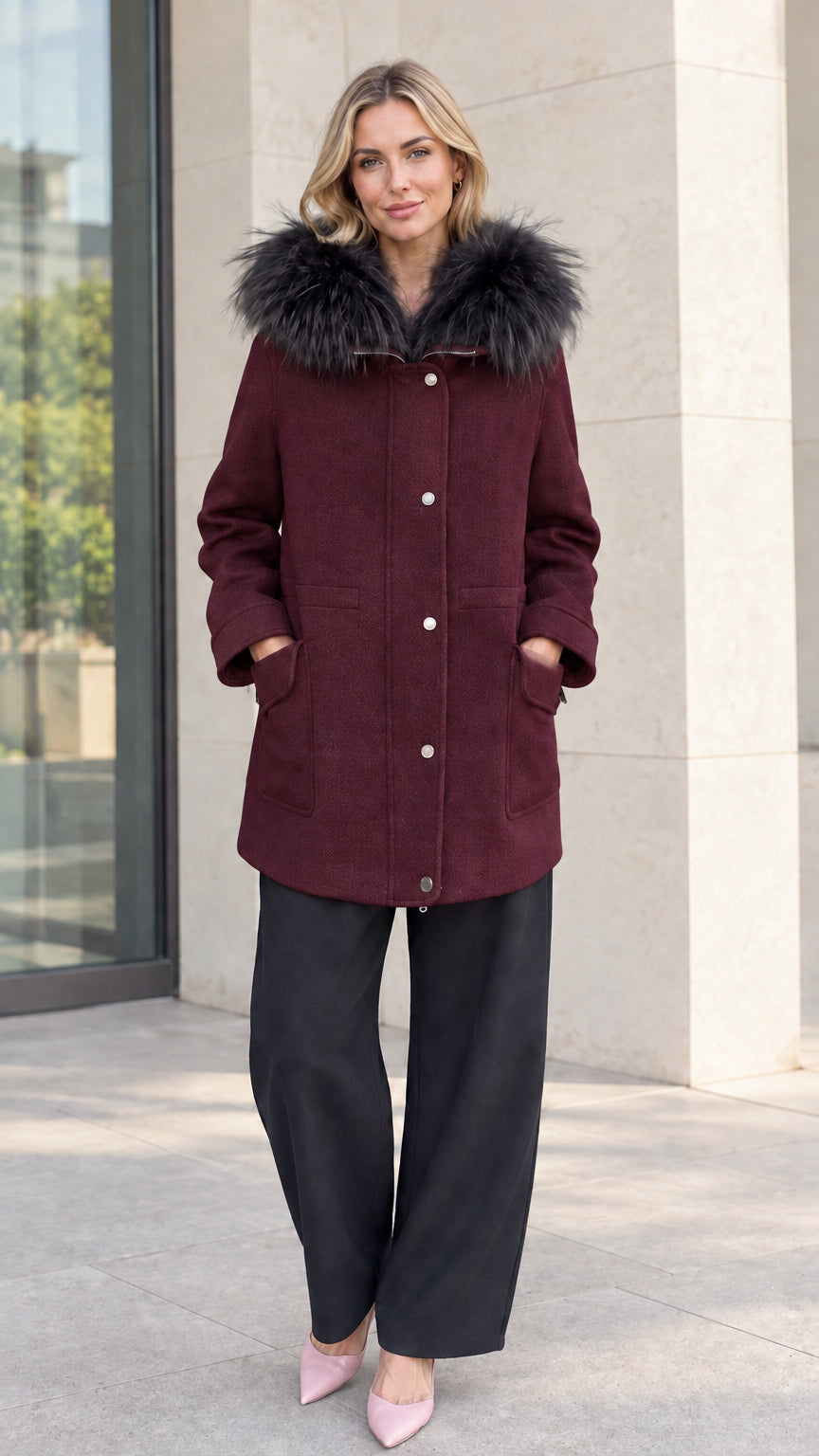 Front view of model wearing burgundy wine faux fur hooded mid-length parka coat