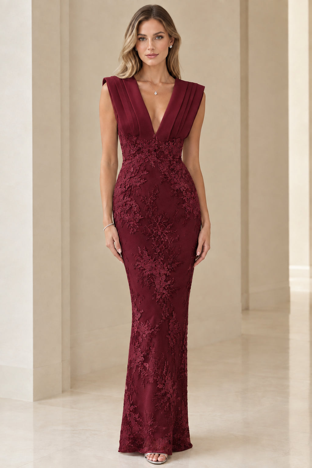 Model wearing burgundy wine red corded lace formal evening dress