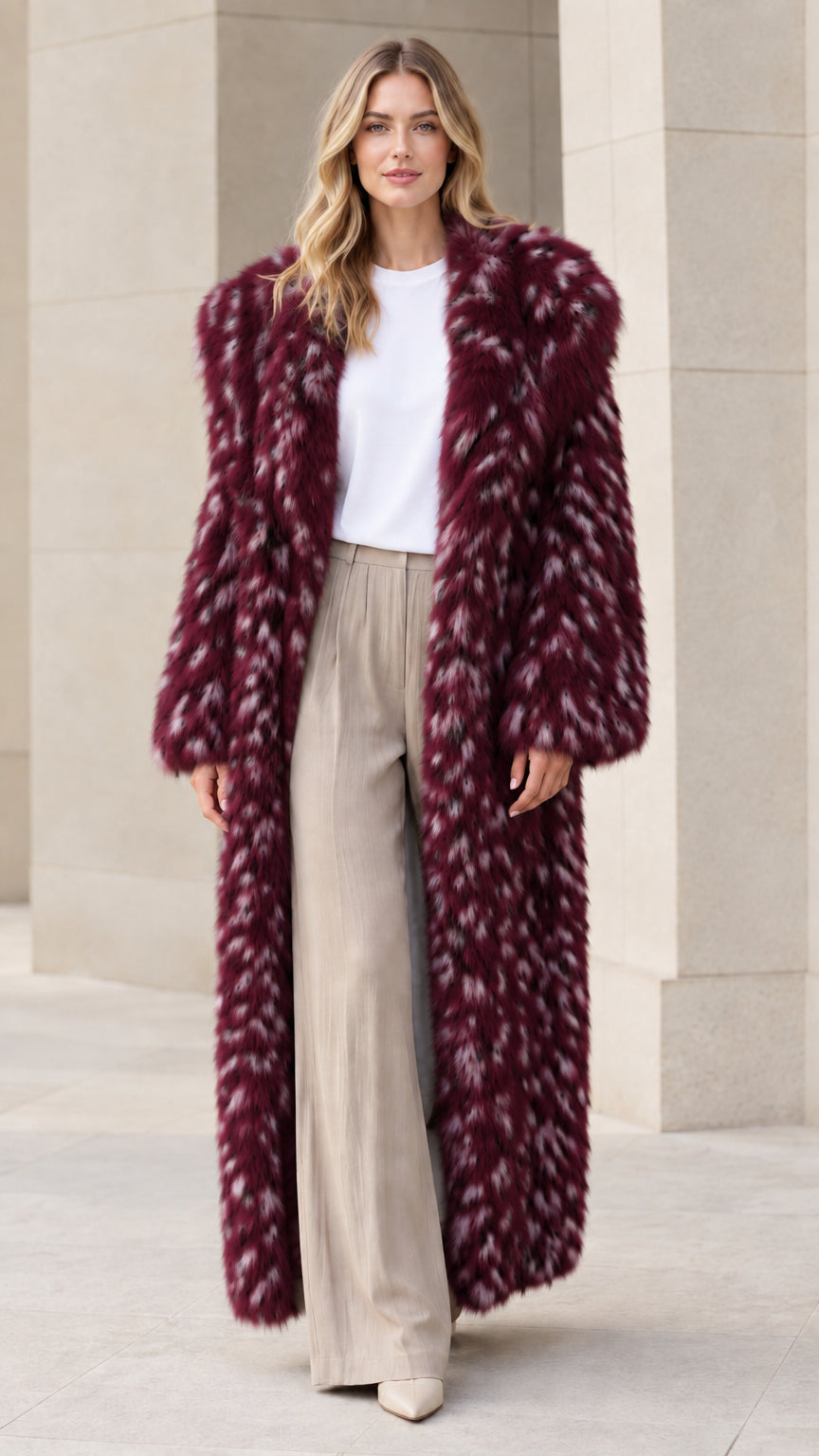 Front view of model wearing burgundy speckled faux fur maxi coat