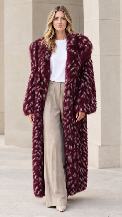 Front view of model wearing burgundy speckled faux fur maxi coat
