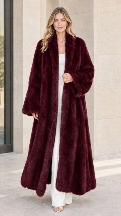Front view of woman wearing burgundy wine red long faux fur maxi coat
