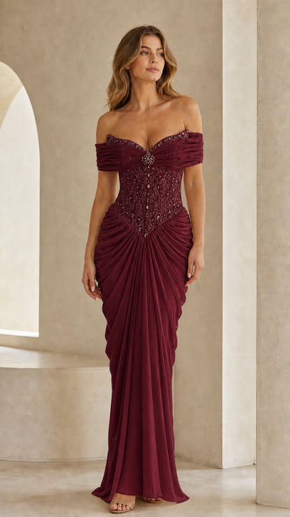 Full front view of burgundy off-the-shoulder beaded evening gown
