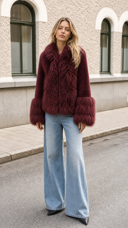 Model wearing burgundy wine red faux fur trimmed short coat