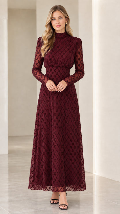 Front full view of woman wearing burgundy wine red geometric long sleeve maxi dress