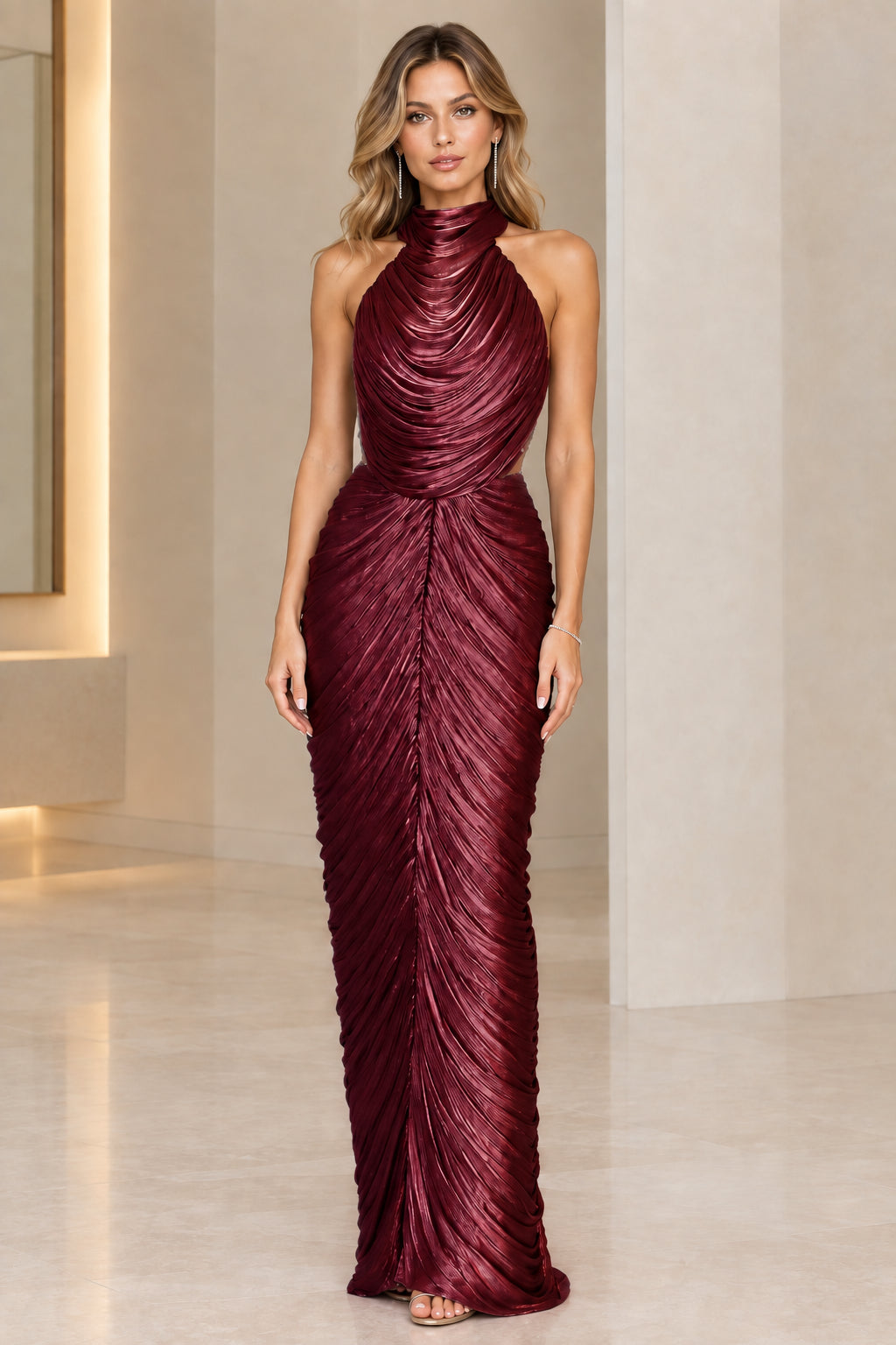 Model wearing burgundy wine metallic ruched open-back evening gown