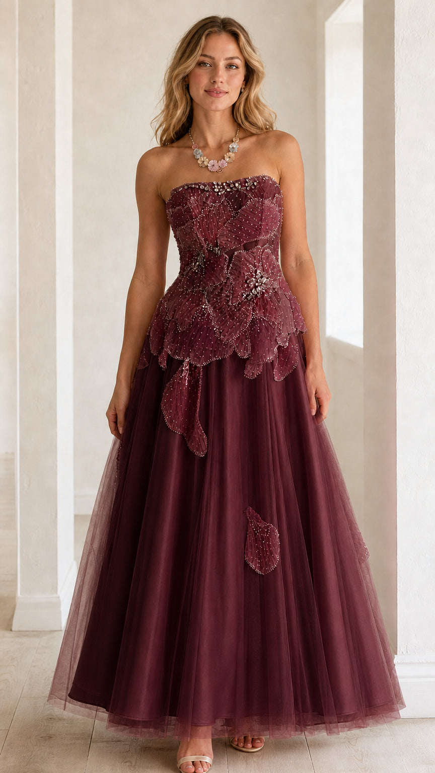Front view of strapless burgundy wine tulle ball gown with beaded petal bodice