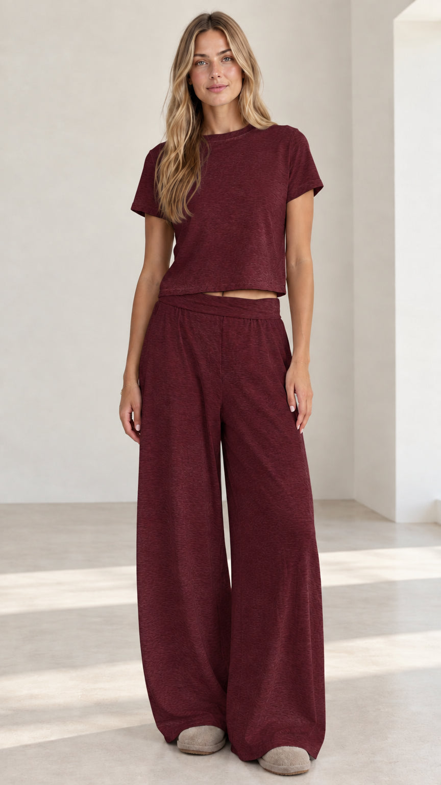 Model wearing burgundy wine red short sleeve crop top and wide leg pants set