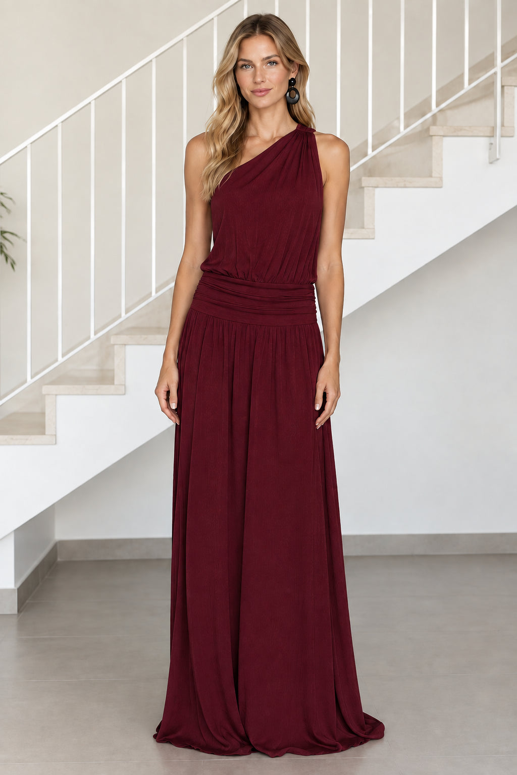 Front view of model wearing burgundy wine one-shoulder ruched waist maxi dress