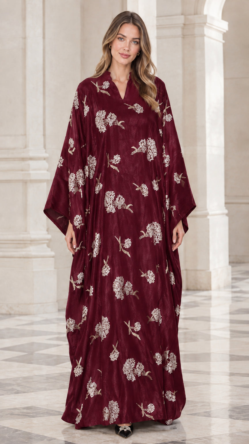 Front view of woman wearing burgundy floral embroidered kaftan maxi dress