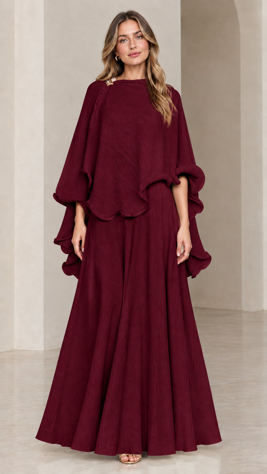 Model wearing burgundy wine red capelet top and maxi skirt set