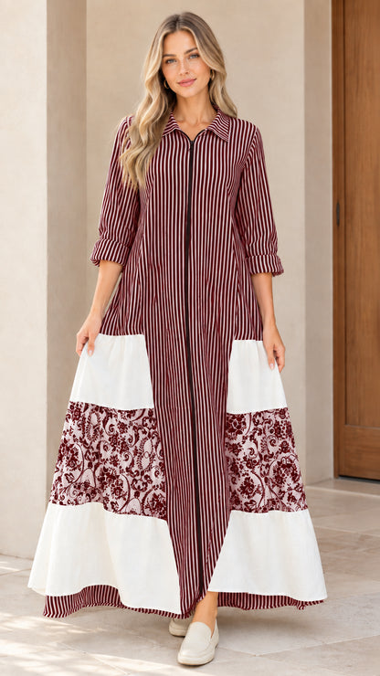 Front view of women's burgundy striped zip-front maxi dress with floral patchwork