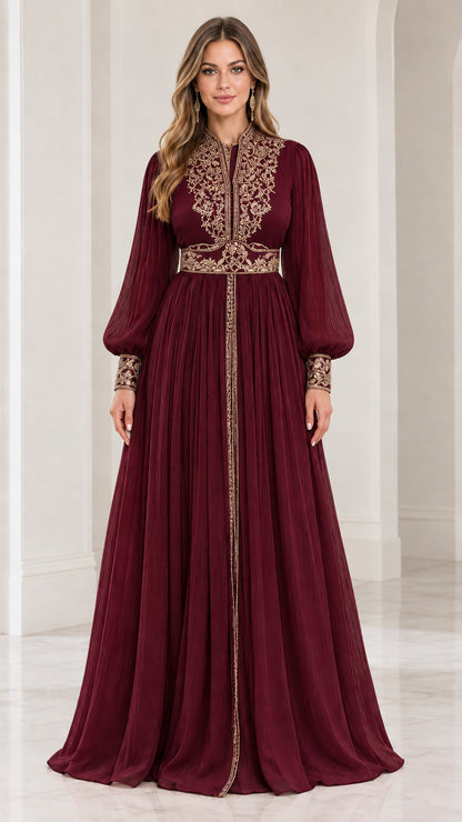 Front view of model wearing burgundy red embroidered long sleeve evening gown