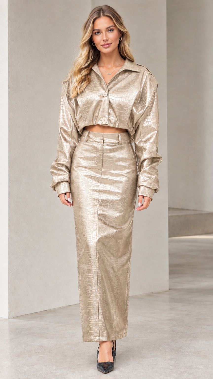 Model wearing champagne metallic crocodile embossed faux leather cropped jacket and maxi skirt set