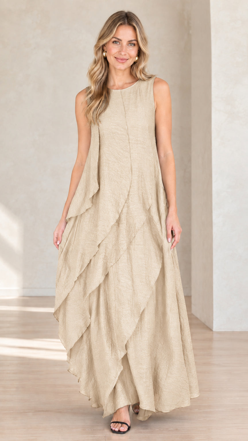 Model wearing beige champagne sleeveless tiered maxi dress