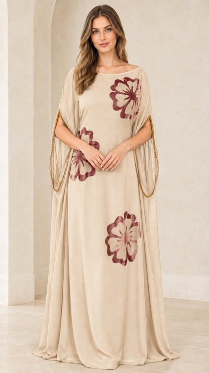 Front view of model wearing Champagne Beige floral applique kaftan maxi gown