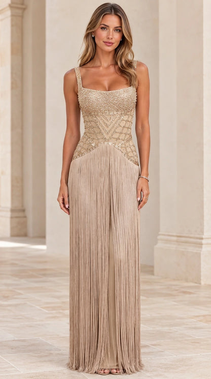 Front view of champagne gold beaded bodice fringe maxi evening gown