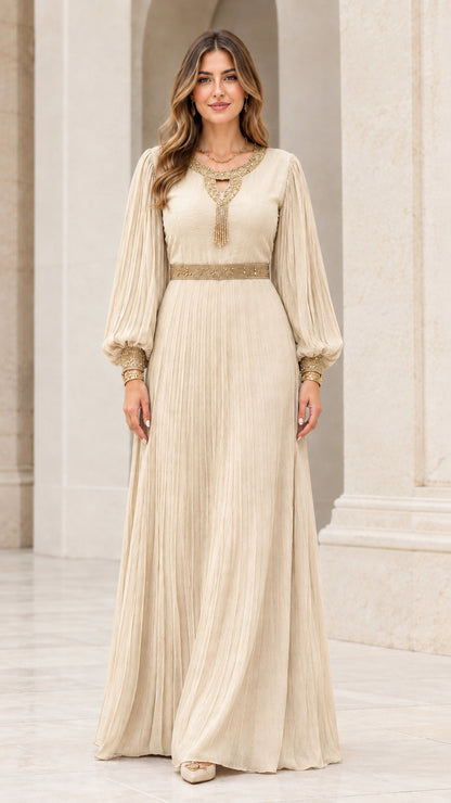 Front view of champagne cream pleated evening maxi gown with metallic embroidery