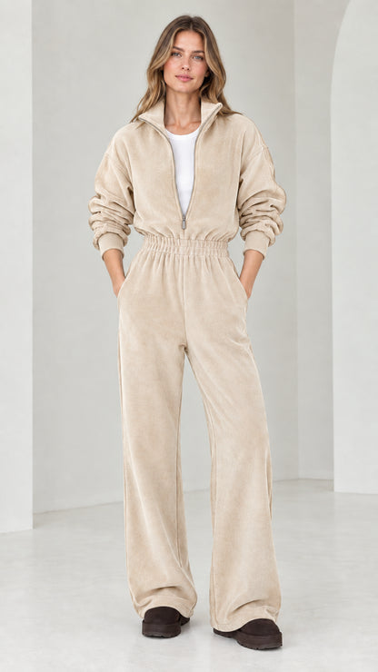 Front view of model wearing beige oatmeal half-zip wide leg fleece jumpsuit