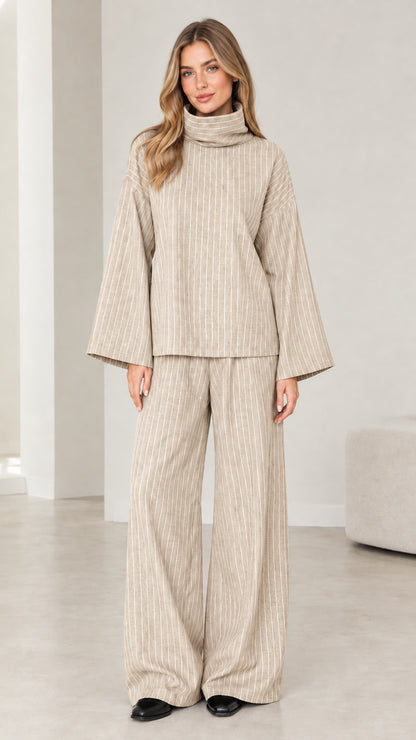 Woman wearing Beige oatmeal pinstripe turtleneck top and wide-leg pants outfit