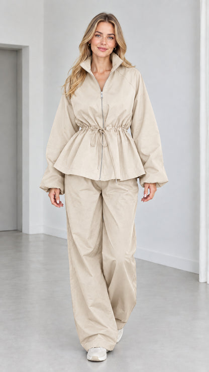 Women's beige drawstring peplum jacket and wide-leg pants matching tracksuit set