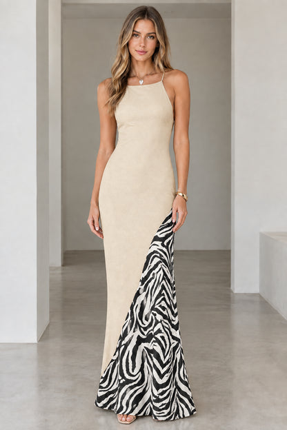 Front view of model wearing the beige champagne maxi dress with zebra print insert