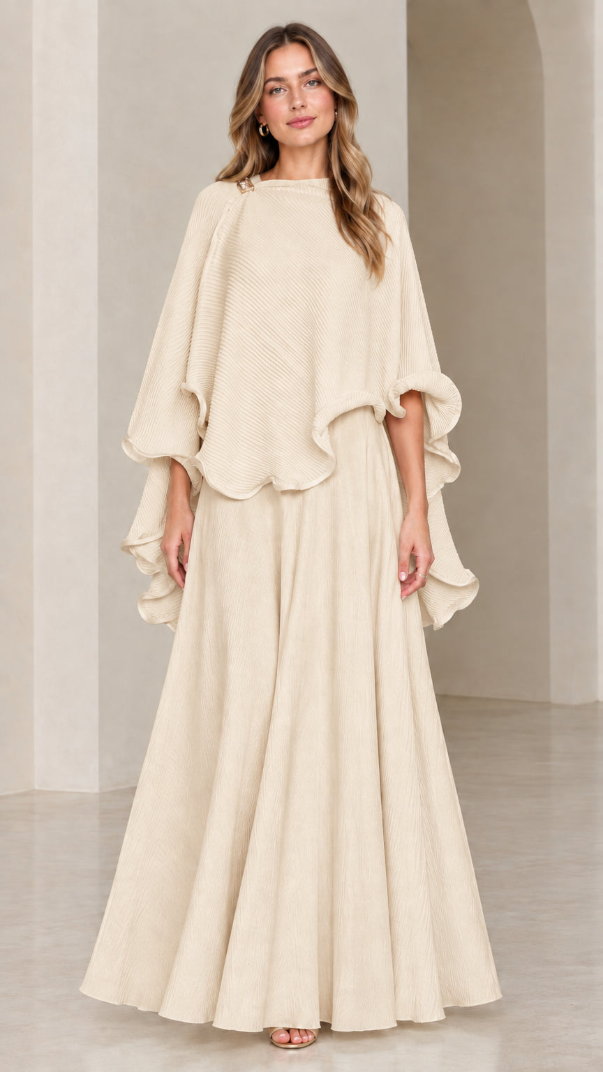 Model wearing beige champagne textured capelet top and maxi skirt set