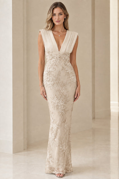 Model wearing champagne cream corded lace pleated V-neck maxi gown