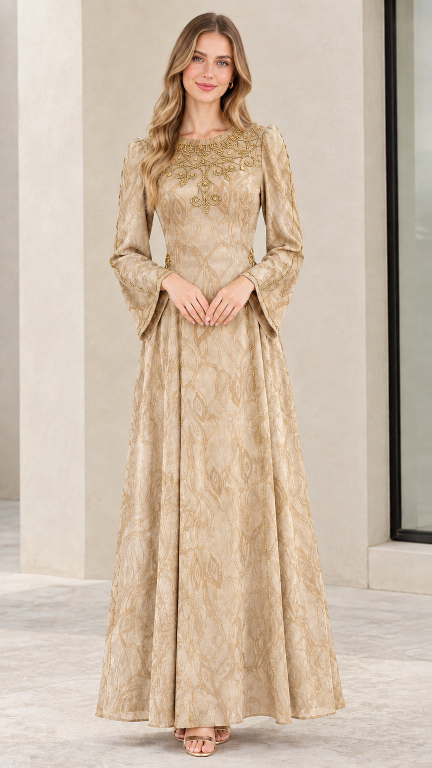 Model wearing champagne gold long-sleeve beaded jacquard gown