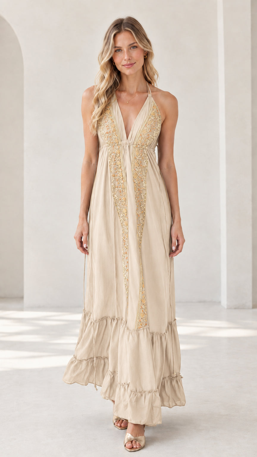 Model wearing beige cream embroidered halter maxi dress