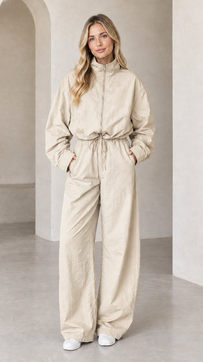 Front full-length view of woman wearing Beige zip-up wide-leg utility jumpsuit