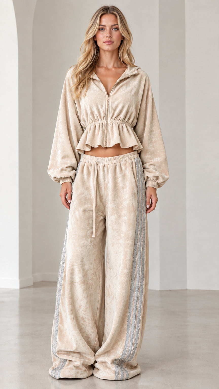 Full-length view of model wearing beige oatmeal velour cropped tracksuit set with wide-leg pants