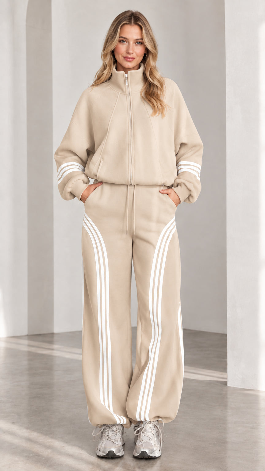 Front view of woman wearing beige two-piece striped tracksuit set