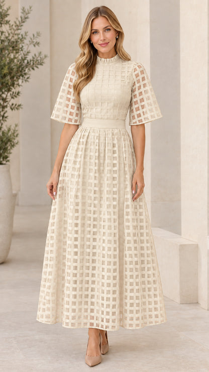 Front view of cream off-white mock neck sheer grid overlay maxi dress