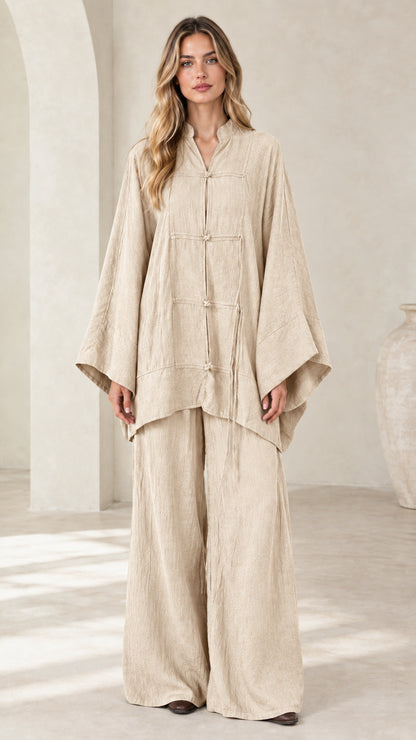 Front view of women's beige oatmeal frog button tunic and wide leg pant set